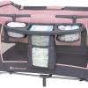 imageBaby Trend Nursery Den Playard with with Rocking Cradle Snooze Pod Flip Over Changer Daisy PinkCozy Pink